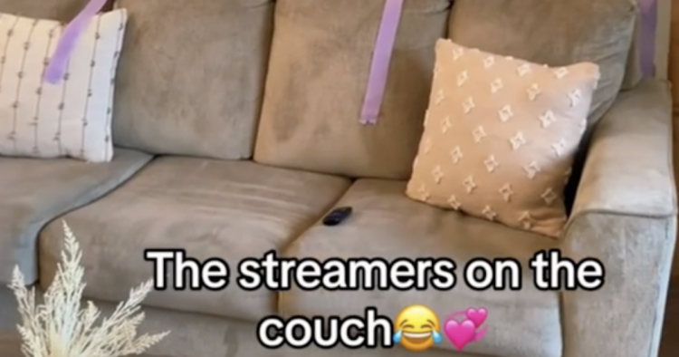 purple streamers draped casually on a couch